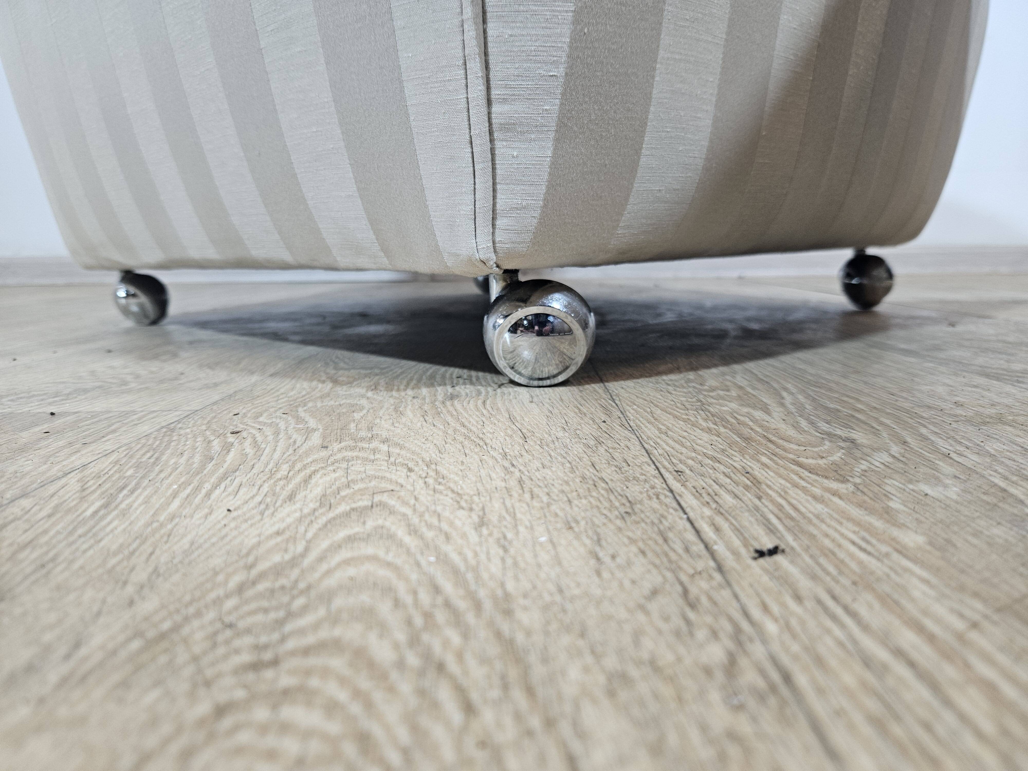 Winged armchair with footstool, 1960s.