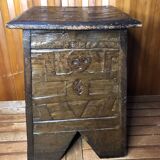 Old stool with vintage carved wood chest