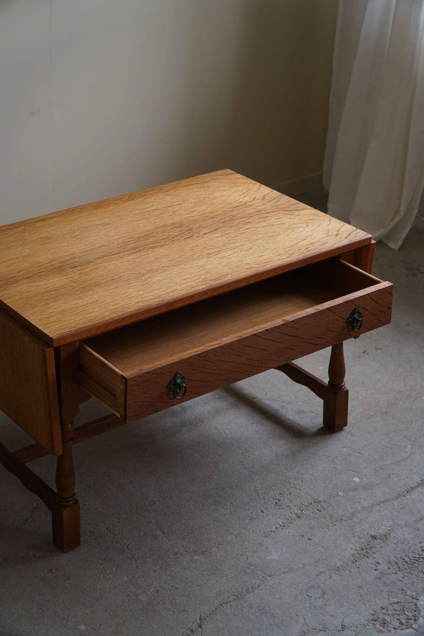 Danish folding table from the mid-century with a drawer in oak, Henning Kjærnulf, 1960s.