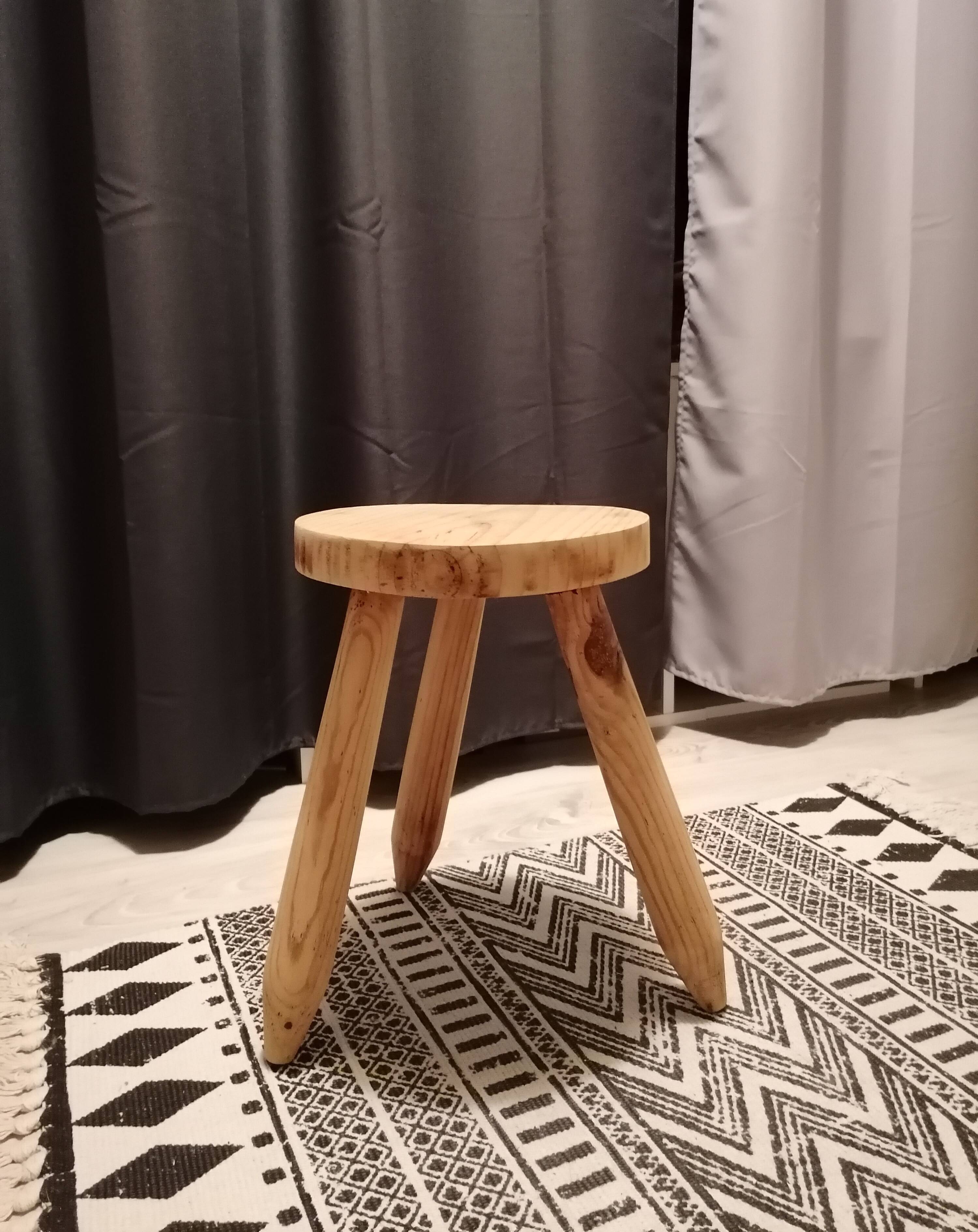 Wooden tripod farm stool