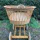 Vintage wicker cradle on casters