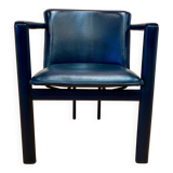 Design armchair in leather and metal.