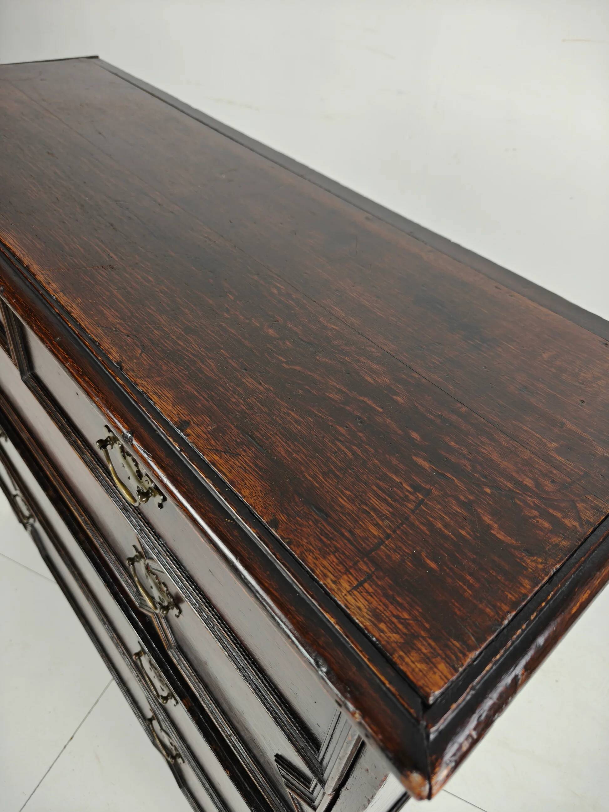 English geometric-panelled oak chest of drawers, circa 1680