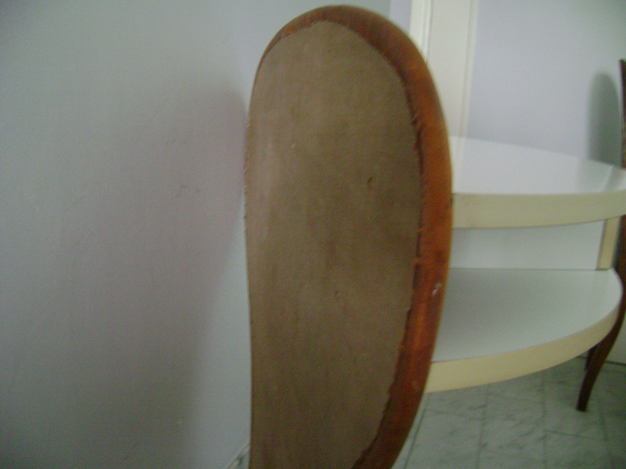 White lasked wood console and 1980s skai background
