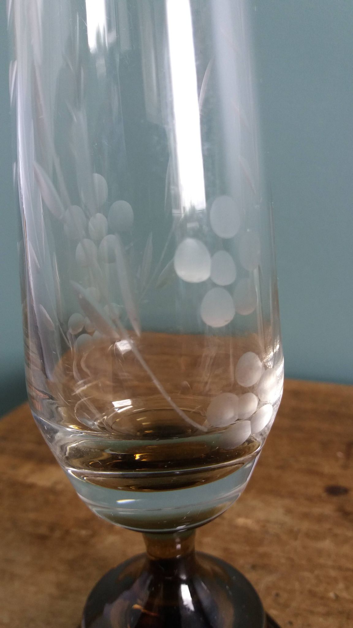 Cut glass soliflore vase with a smoked glass base.