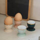 Four coloured egg cups with a golden rim from the 50s.