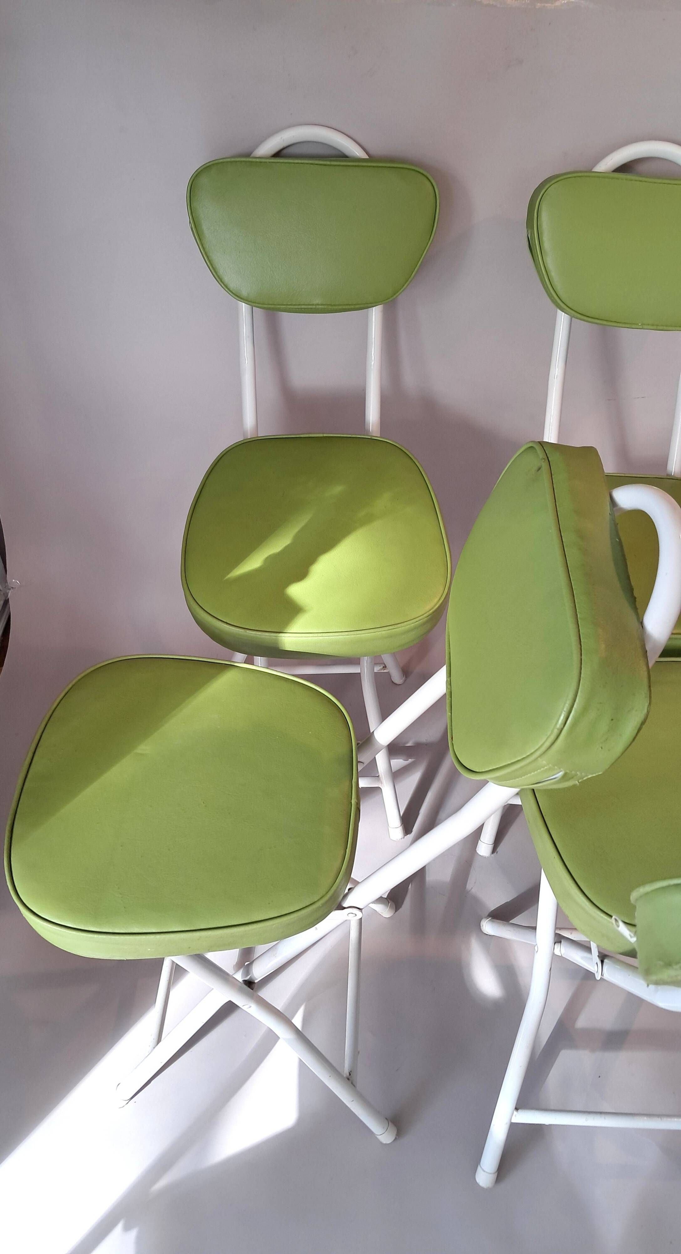 Set of 4 folding cocktail chairs in olive green faux leather from the 1970s.