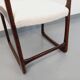 Vintage sled chair by Baumann in wood and boucle fabric.