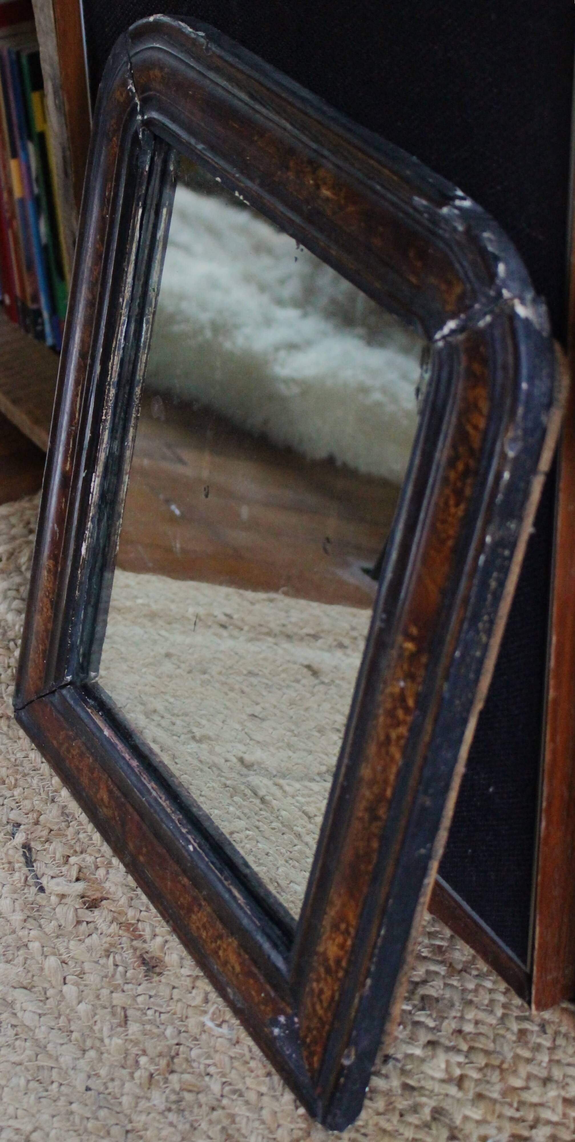 Antique Louis Philippe mirror in black and brown.