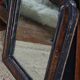 Antique Louis Philippe mirror in black and brown.