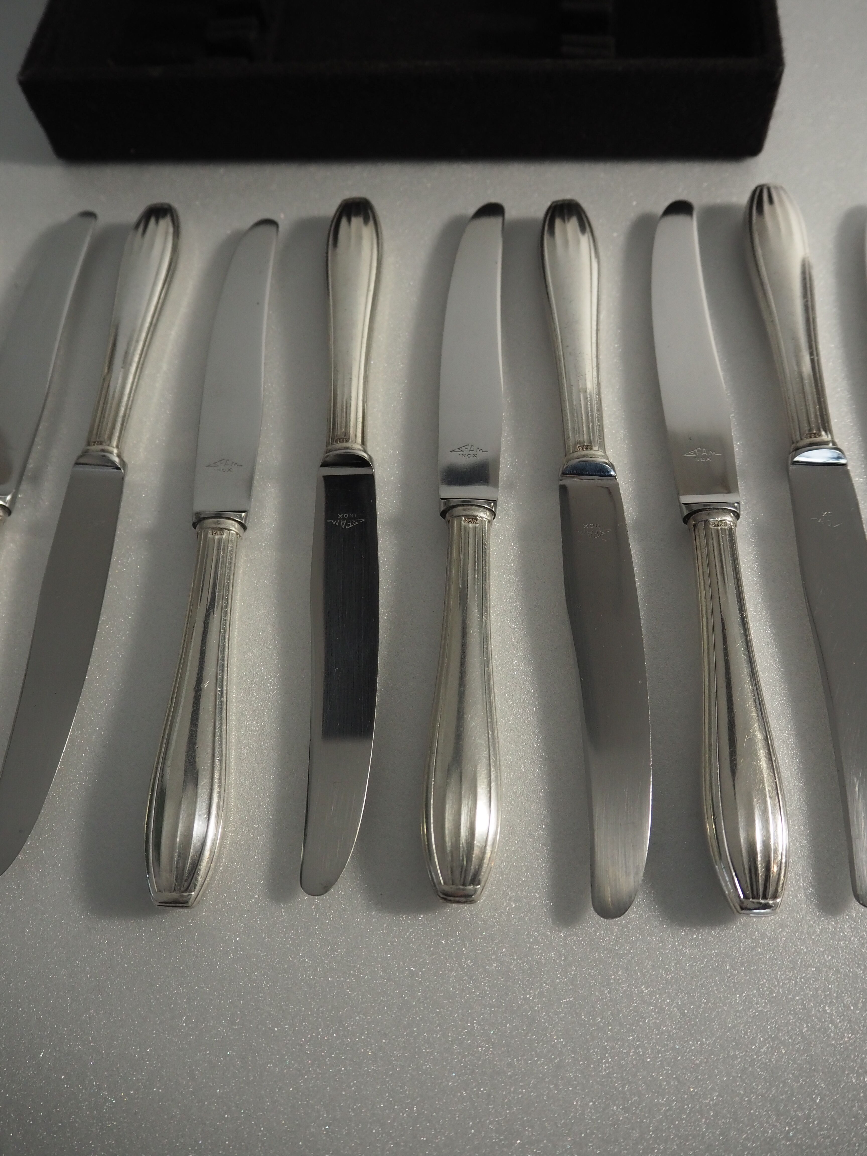 12 SFAM cheese knives in its dark chocolate case