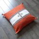 Moroccan Berber cushion in orange and white.