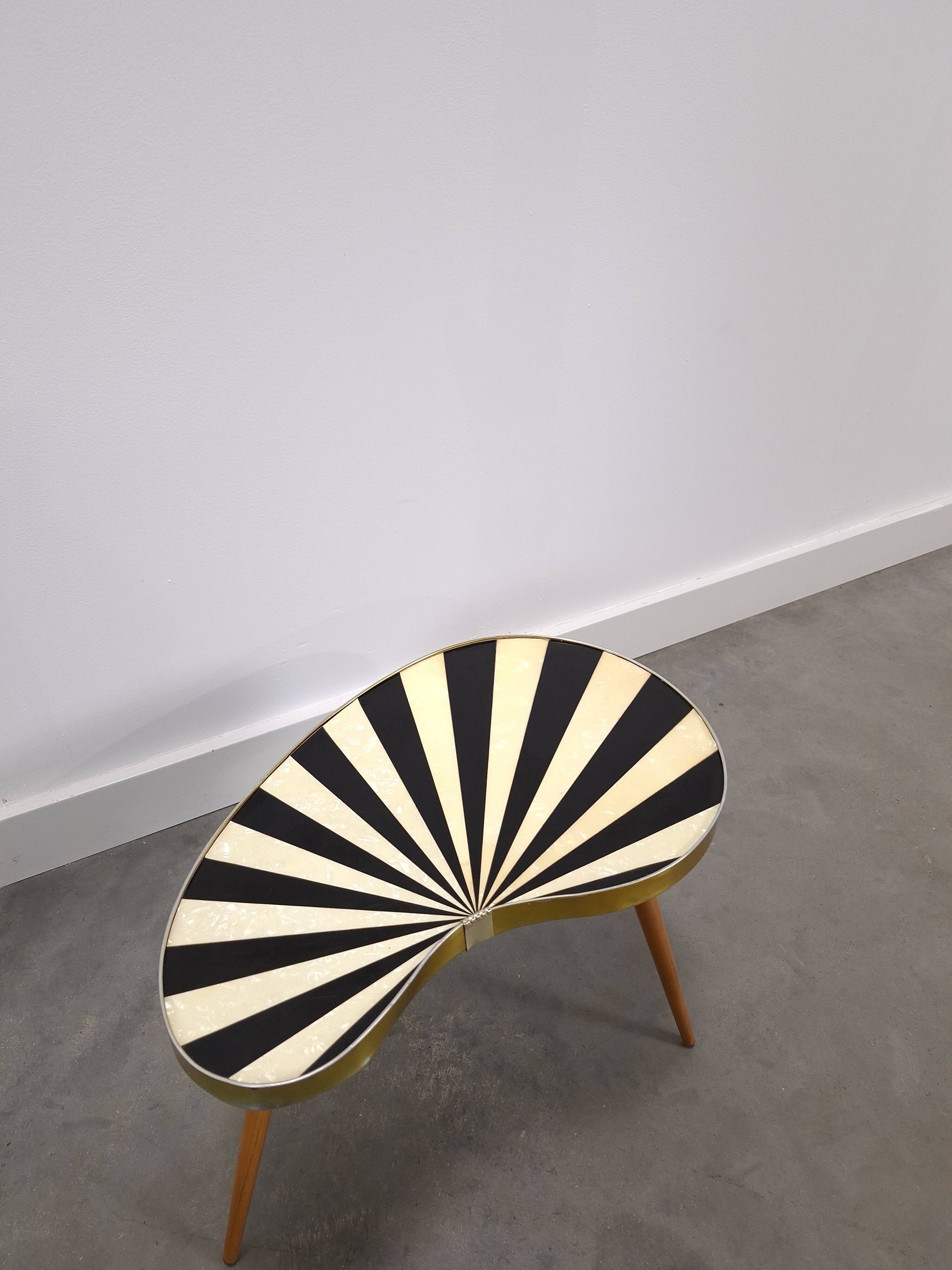 1950s kidney-shaped black and white table, plant table.