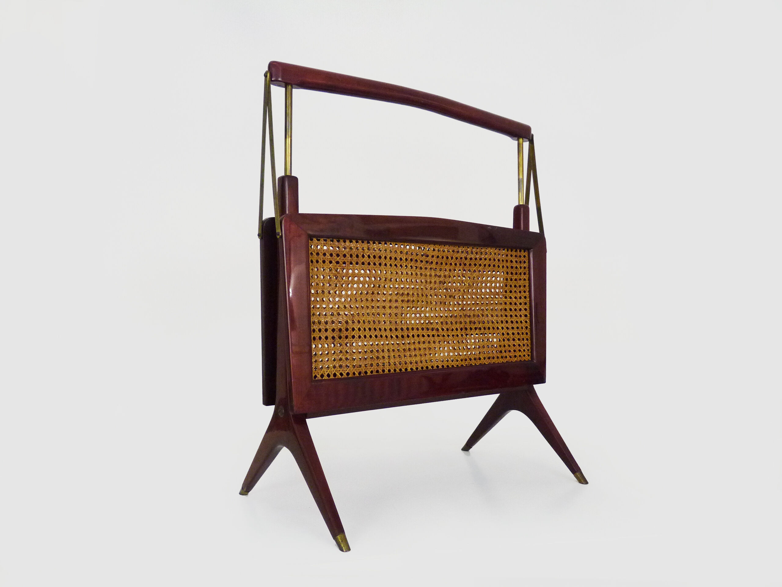 Magazine holders, italy, 1950s. walnut, canage, brass