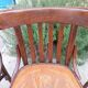 4 bentwood bistro chairs with a pattern on the seat