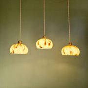 Trio of Art Deco pendant lights in marbled opaline glass, 1920s-30s