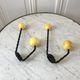 Duo of hooks balls in yellow wood and black iron 60s