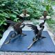Pair of chimera candle holders in bronze, 19th century.