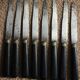 8 couteaux viroles gravées et bois noir