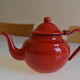 Vintage tea in red and black enamelled sheet
