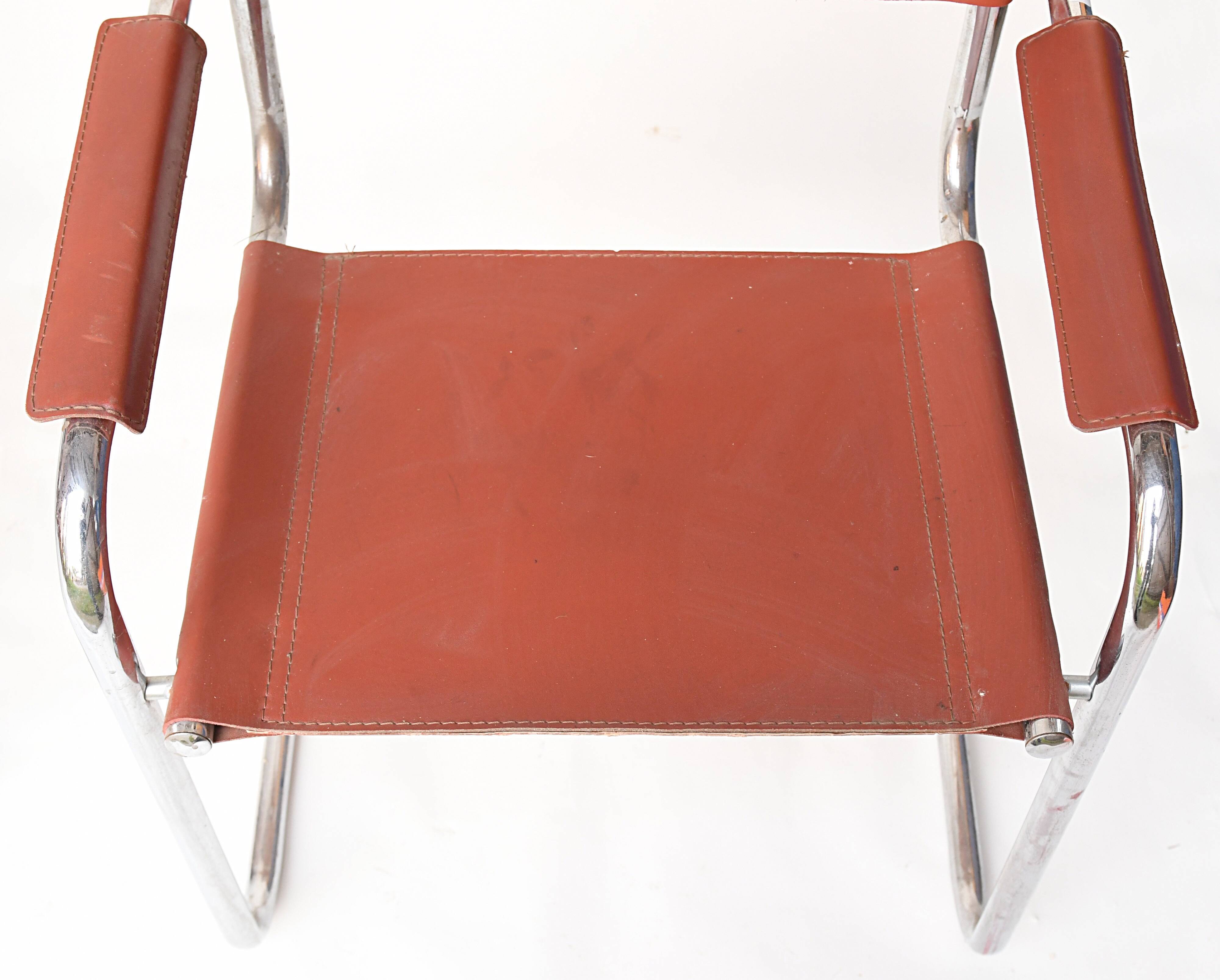 Pair of armchairs in brown saddle leather