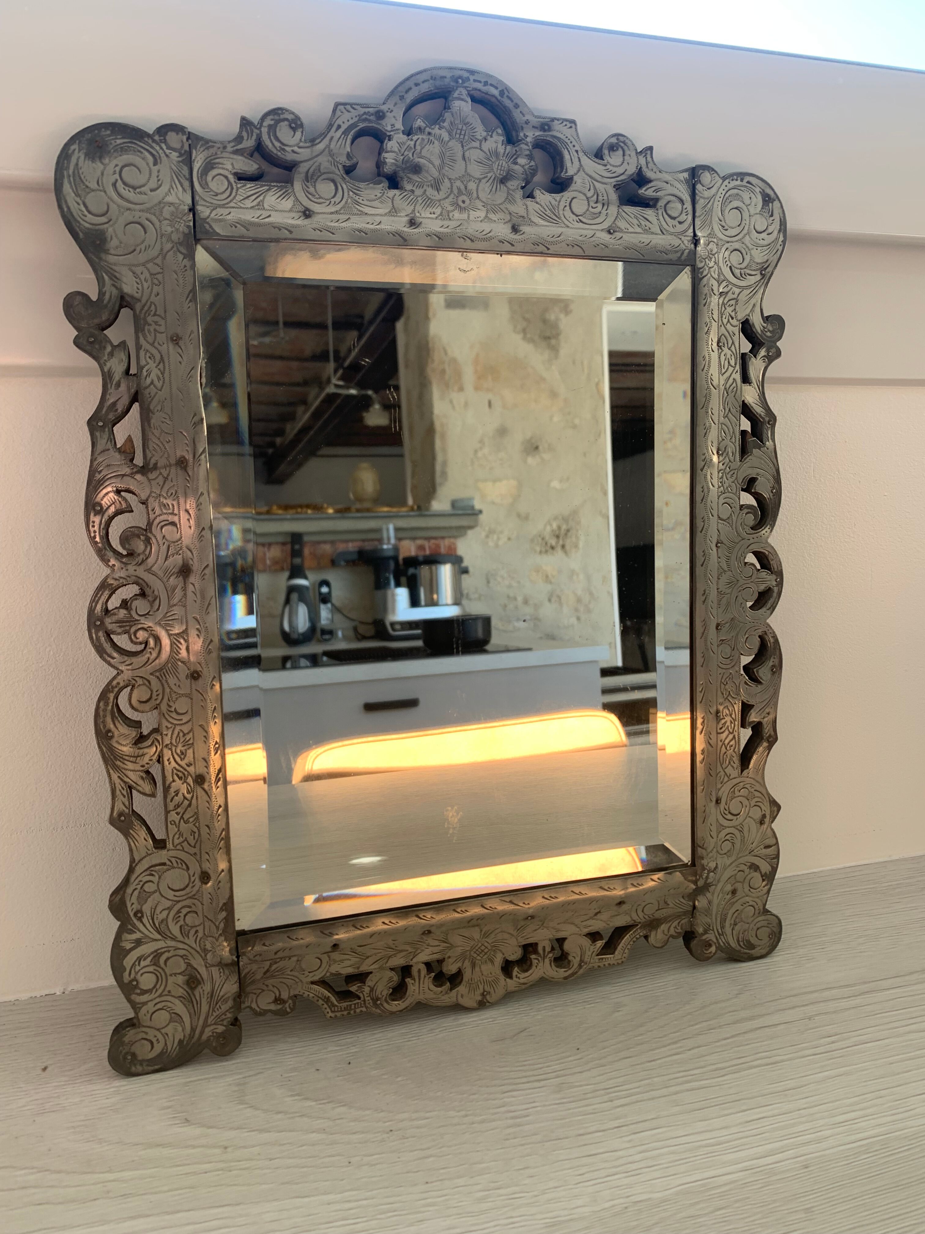 Eventful beveled mirror and openwork period 1900 repelled tin decoration