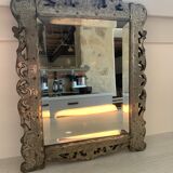 Eventful beveled mirror and openwork period 1900 repelled tin decoration