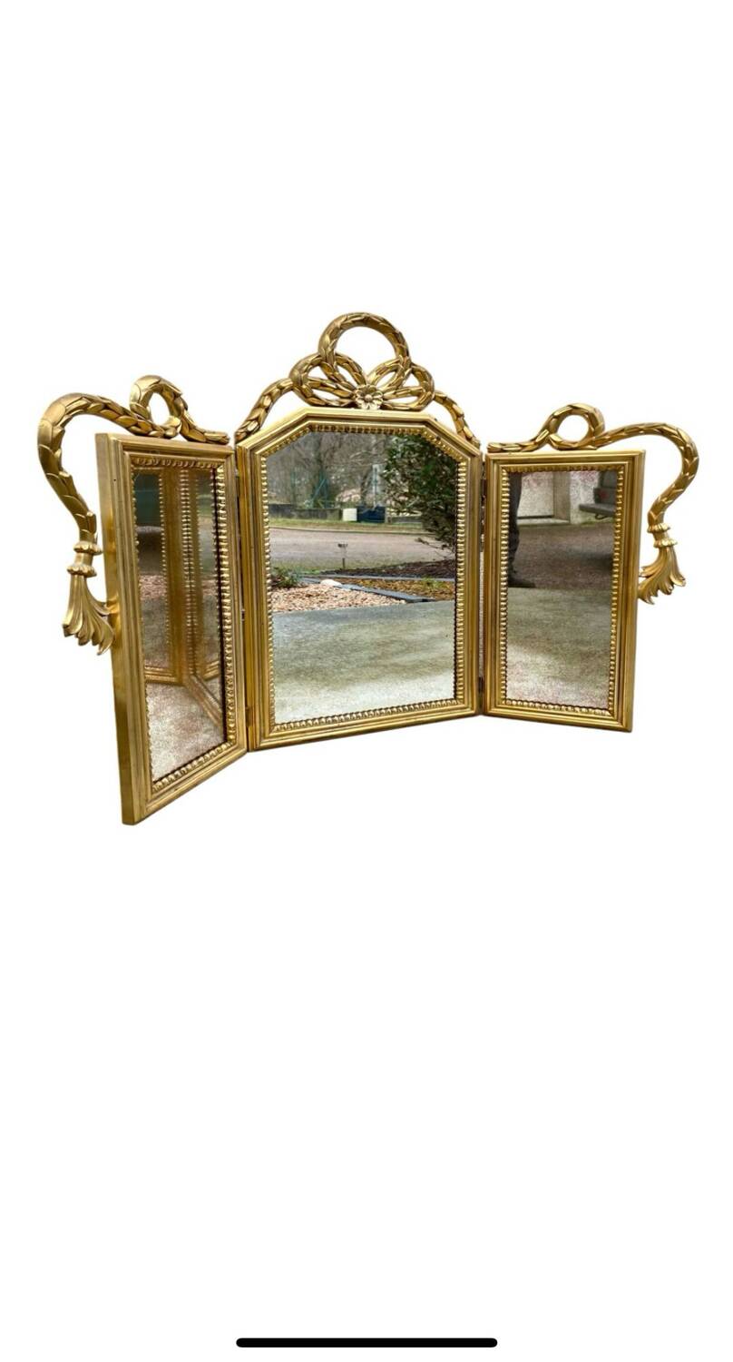 Miroir triptyque en bois doré et sculpté