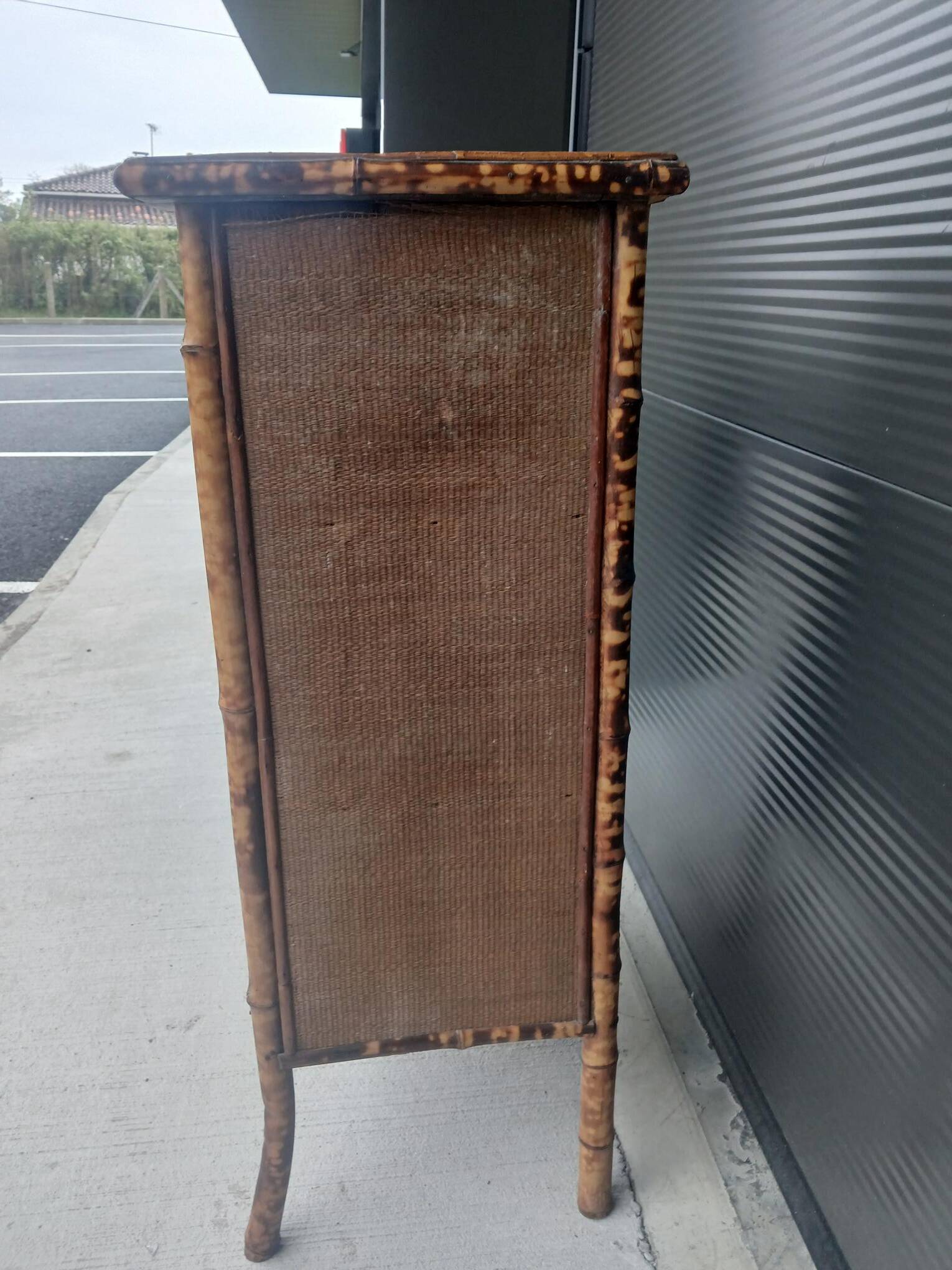 burnt bamboo wardrobe and grass cloth
