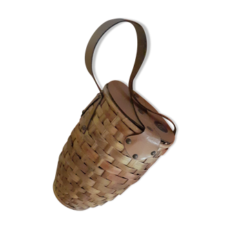 Old rattan and leather bottle holder