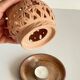 Handmade terracotta tealight candle holder
