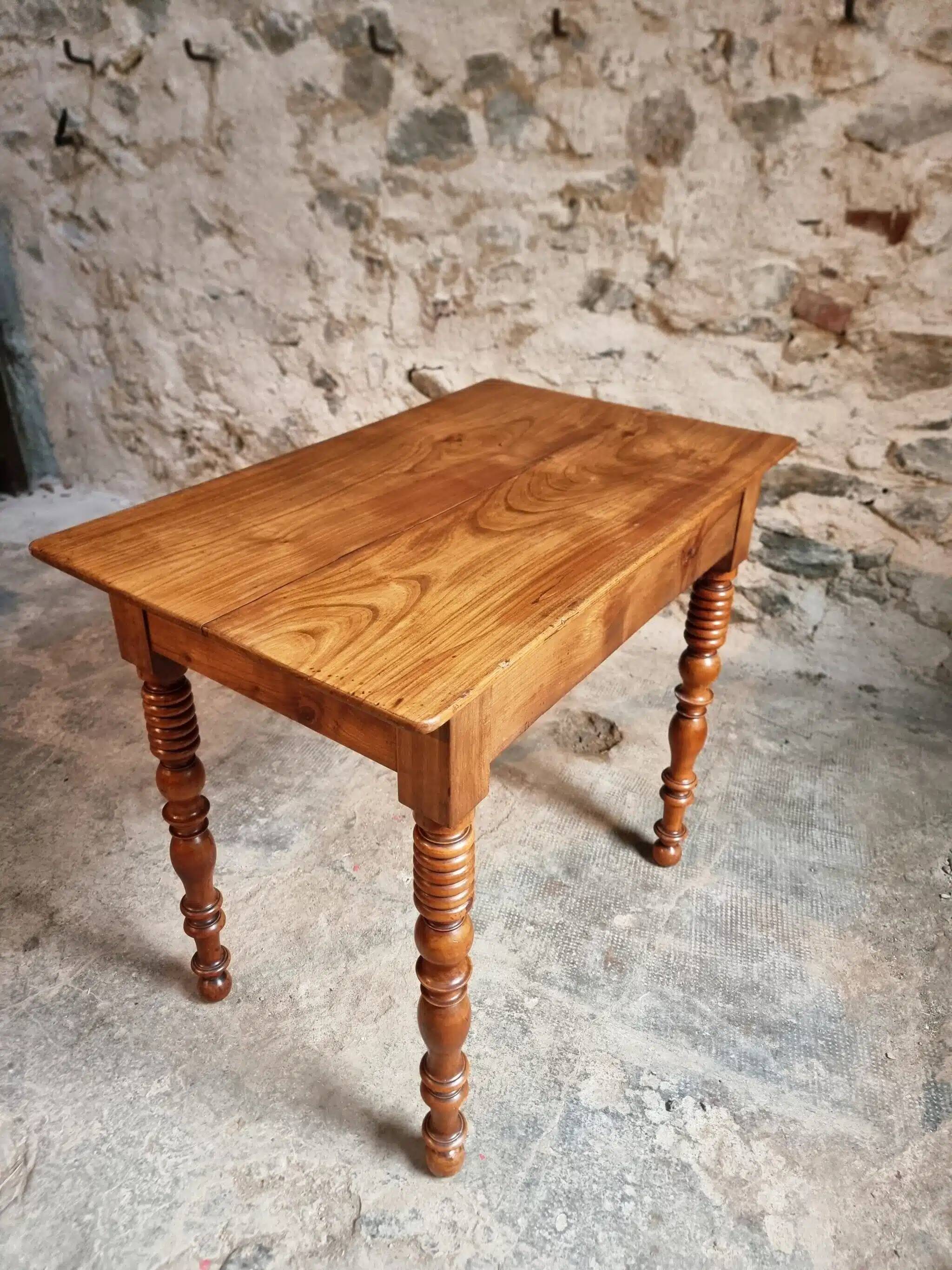 Small antique French writing table in walnut with a drawer, around 1900.