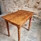 Small antique French writing table in walnut with a drawer, around 1900.