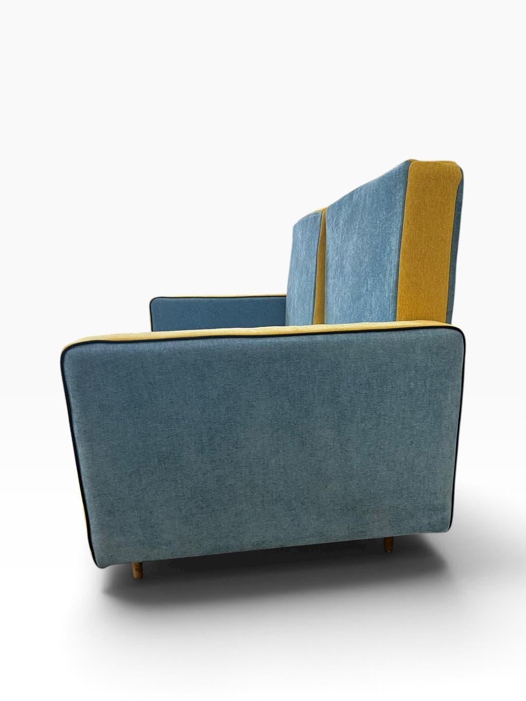 Vintage blue armchair/daybed/sofa bed with yellow accents.