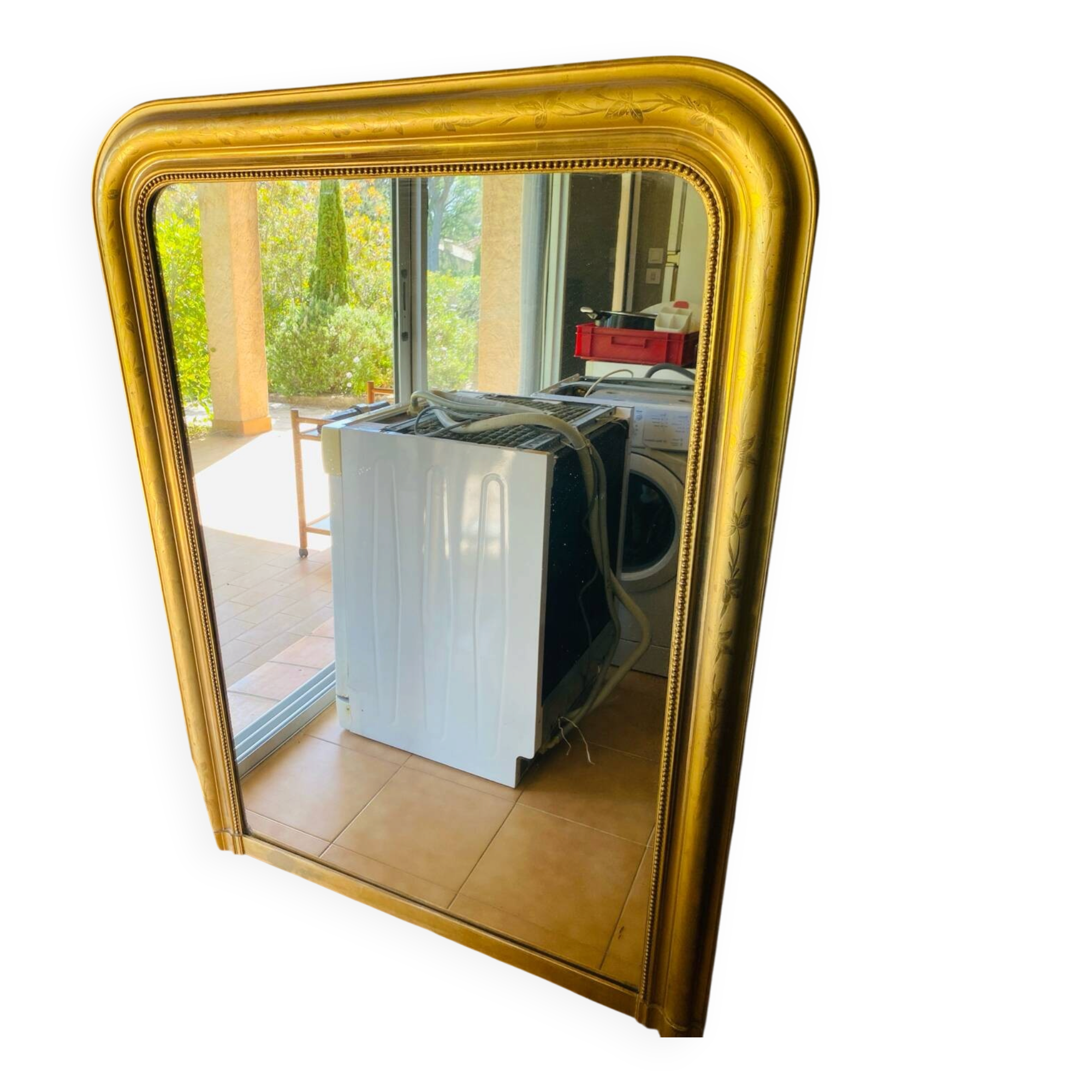 Large antique mirror with gold leaf in the Louis XV style.