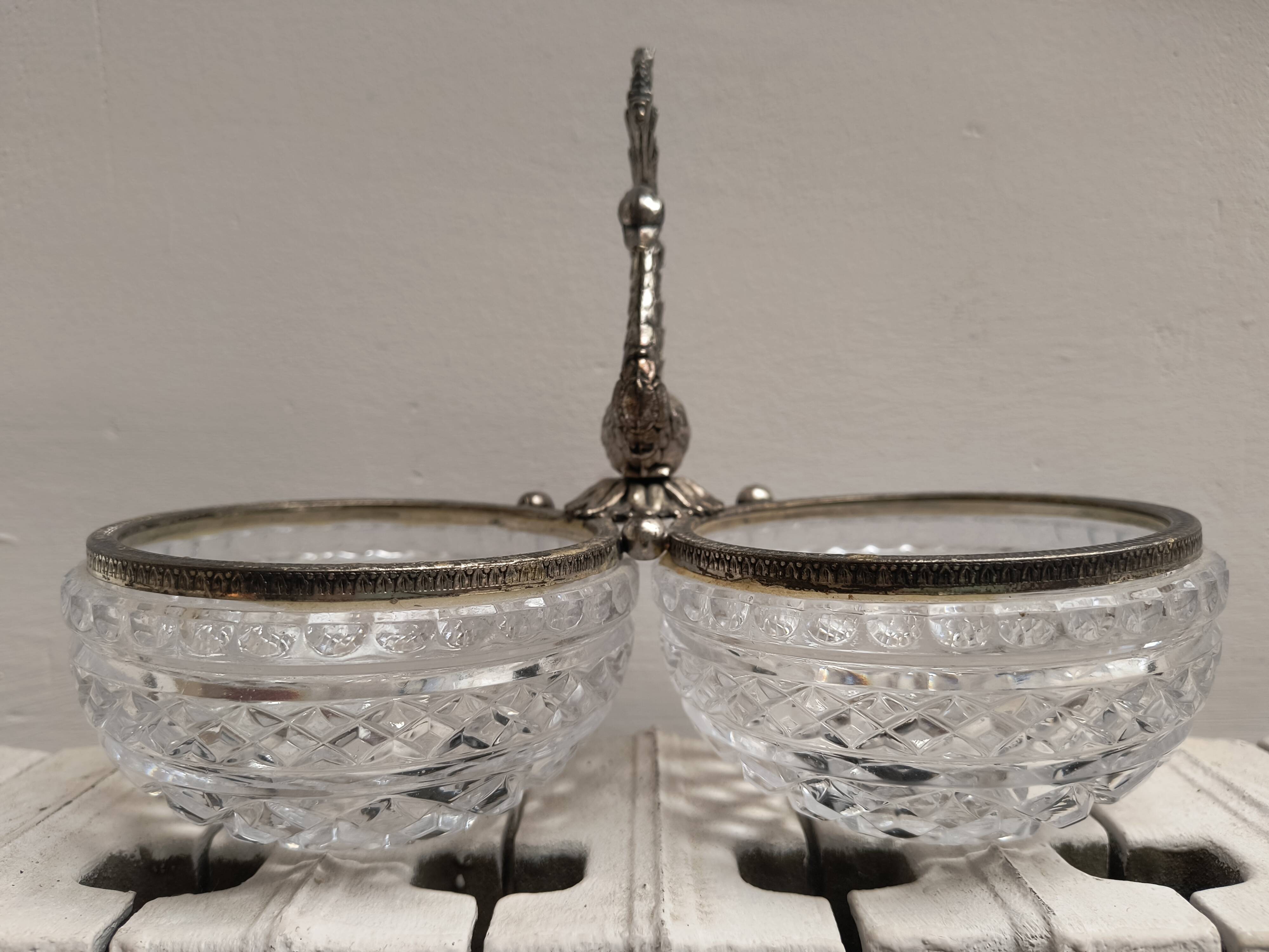 Crystal bowls joined by "swan neck" creation.