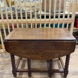 Wooden table with gateleg flaps