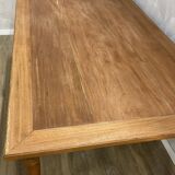 Dining table with tapered legs and solid exotic wood