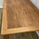 Dining table with tapered legs and solid exotic wood