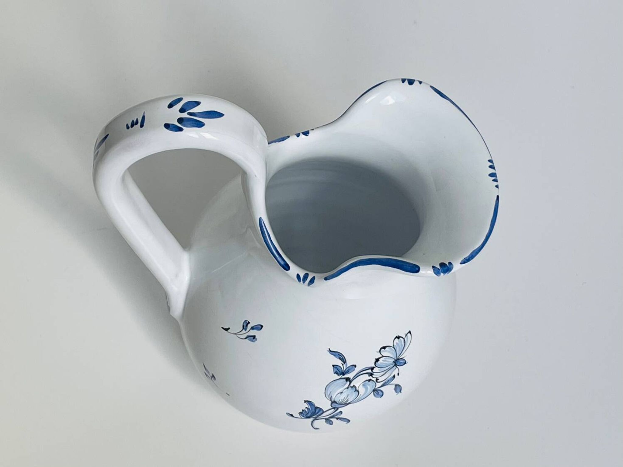 Moustiers pitcher with blue floral decoration