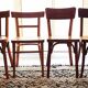 Set of 4 light wood bistro chairs stamped Baumann and Thonet.