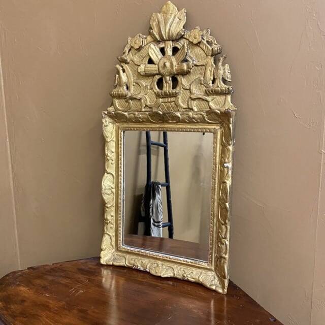 Small antique mirror in gilded wood, regency style