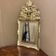 Small antique mirror in gilded wood, regency style
