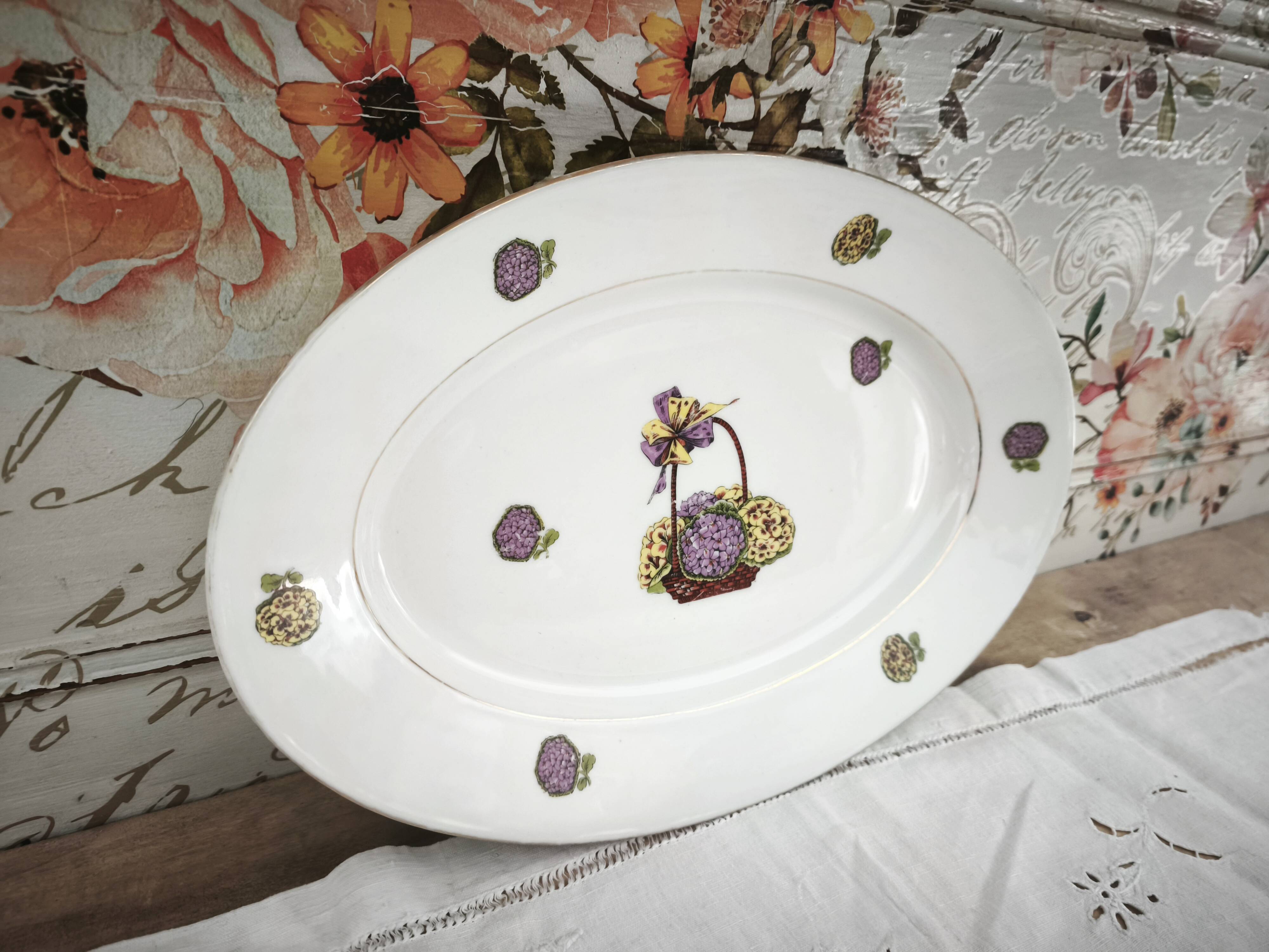 Oval porcelain plate from Limoges with a hydrangea basket design.