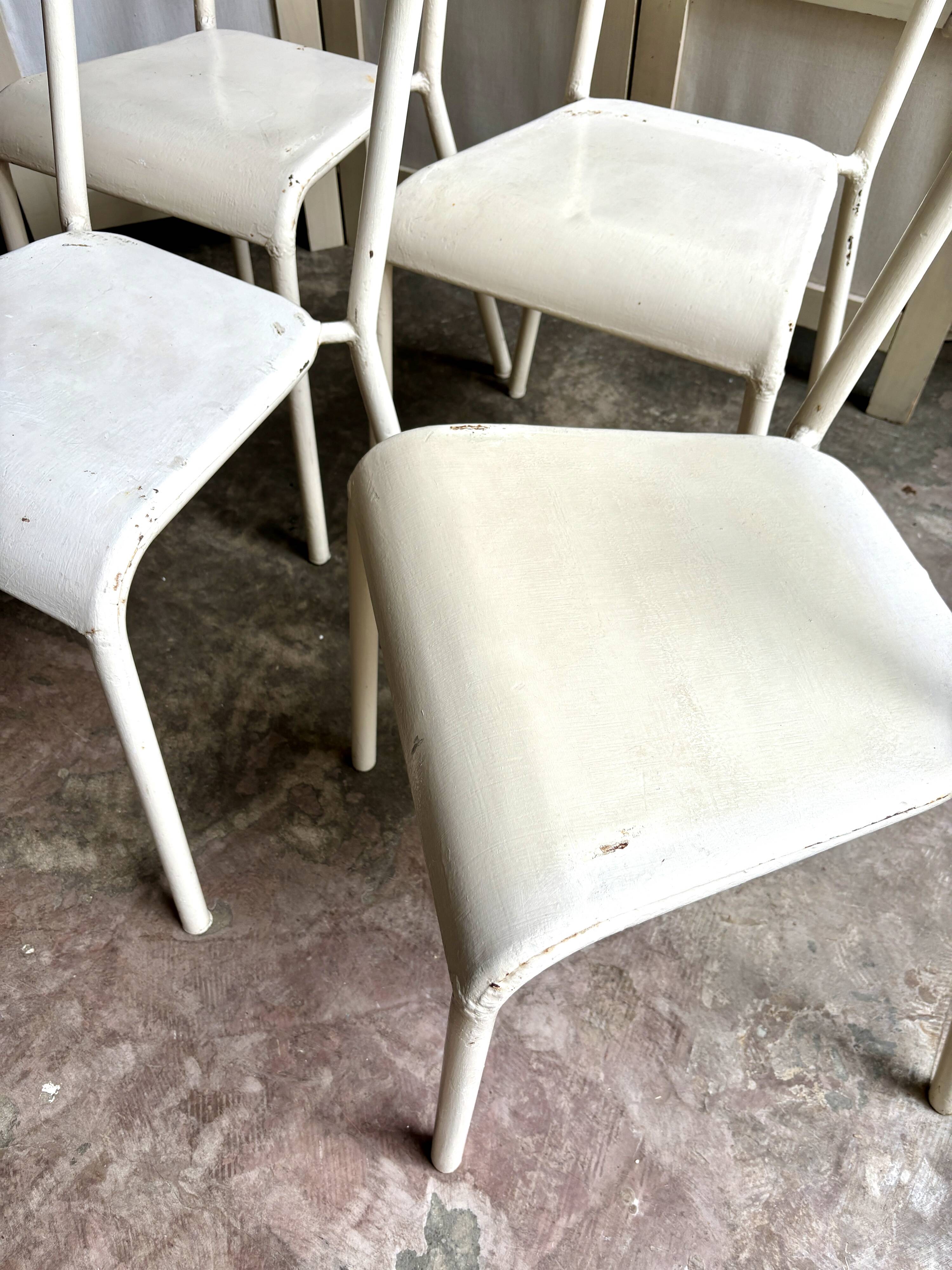 4 beige metal garden chairs