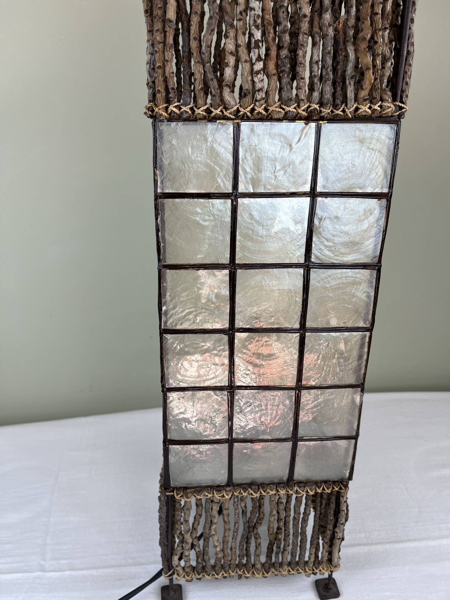 Capiz shell lamp and woven twigs