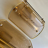 Pair of brass and smoked glass wall lights