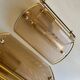 Pair of brass and smoked glass wall lights