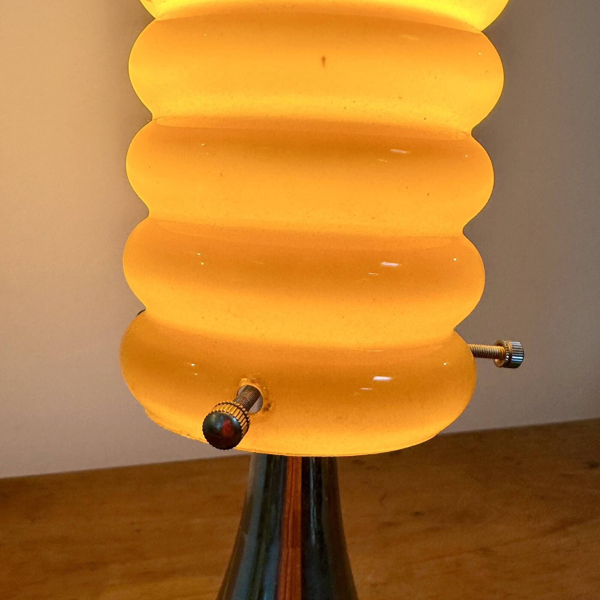 Vintage orange lamp with chrome tulip base and glass shade