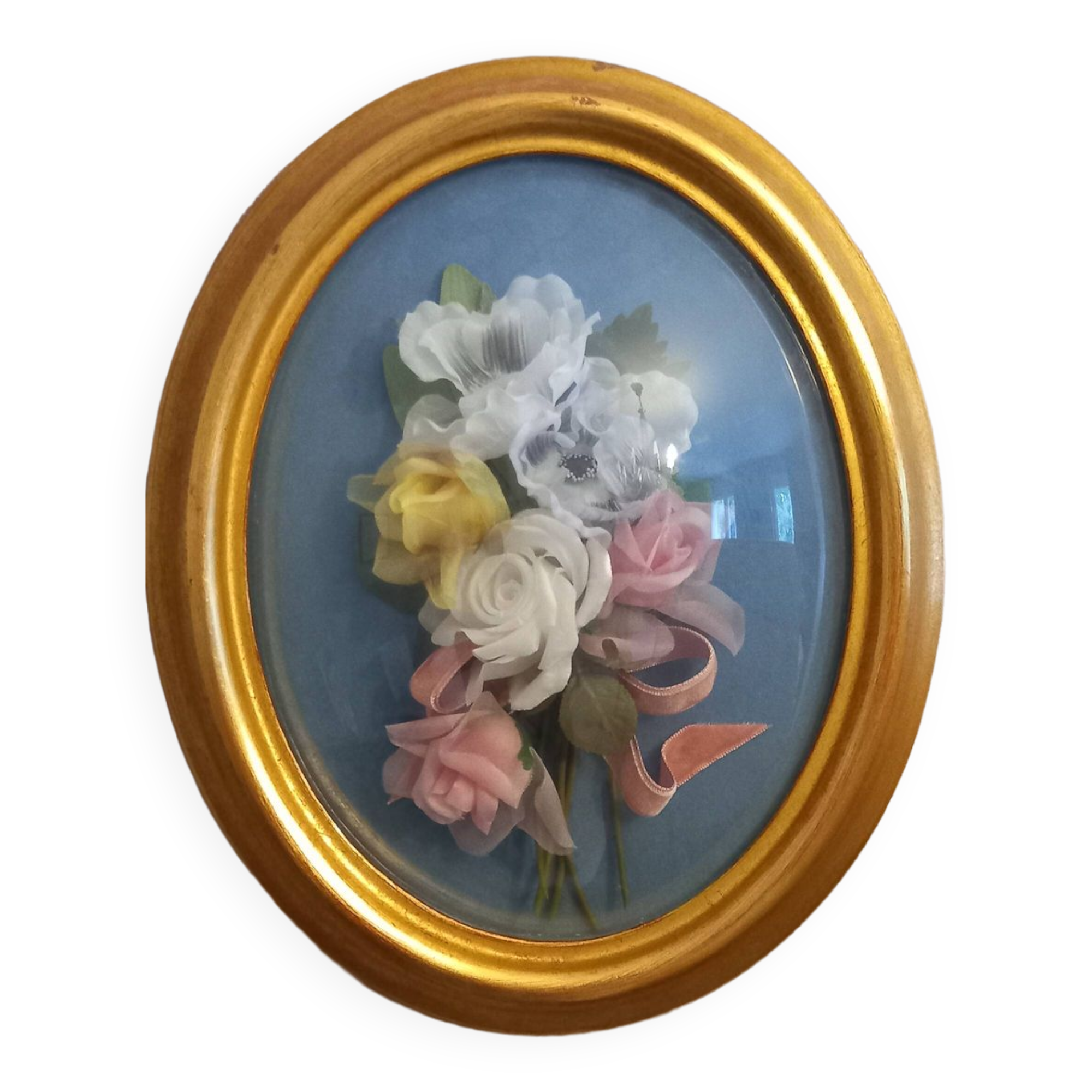 Silk flower frame under curved glass